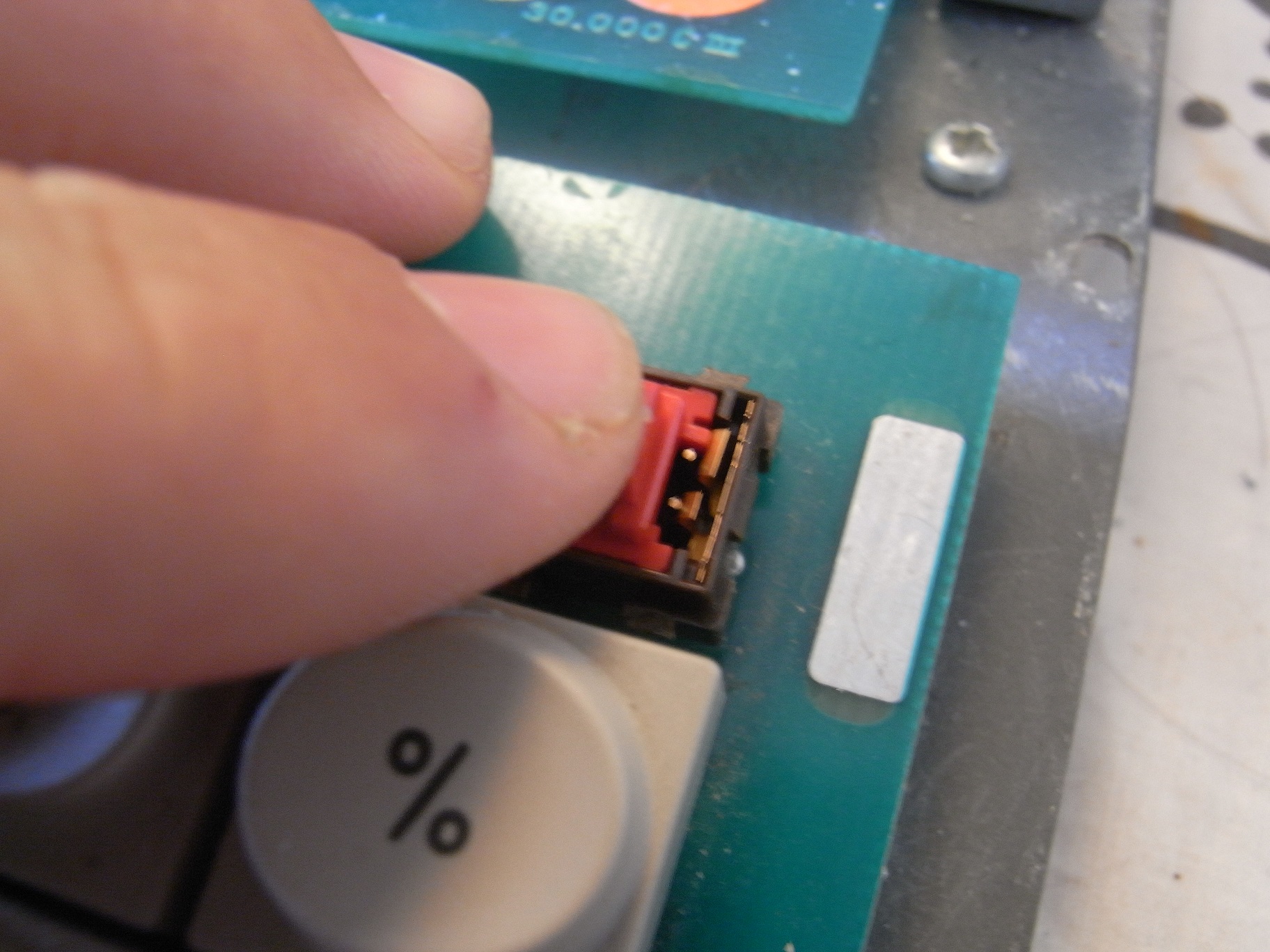 Default position, spring contact held open by pin on slider.