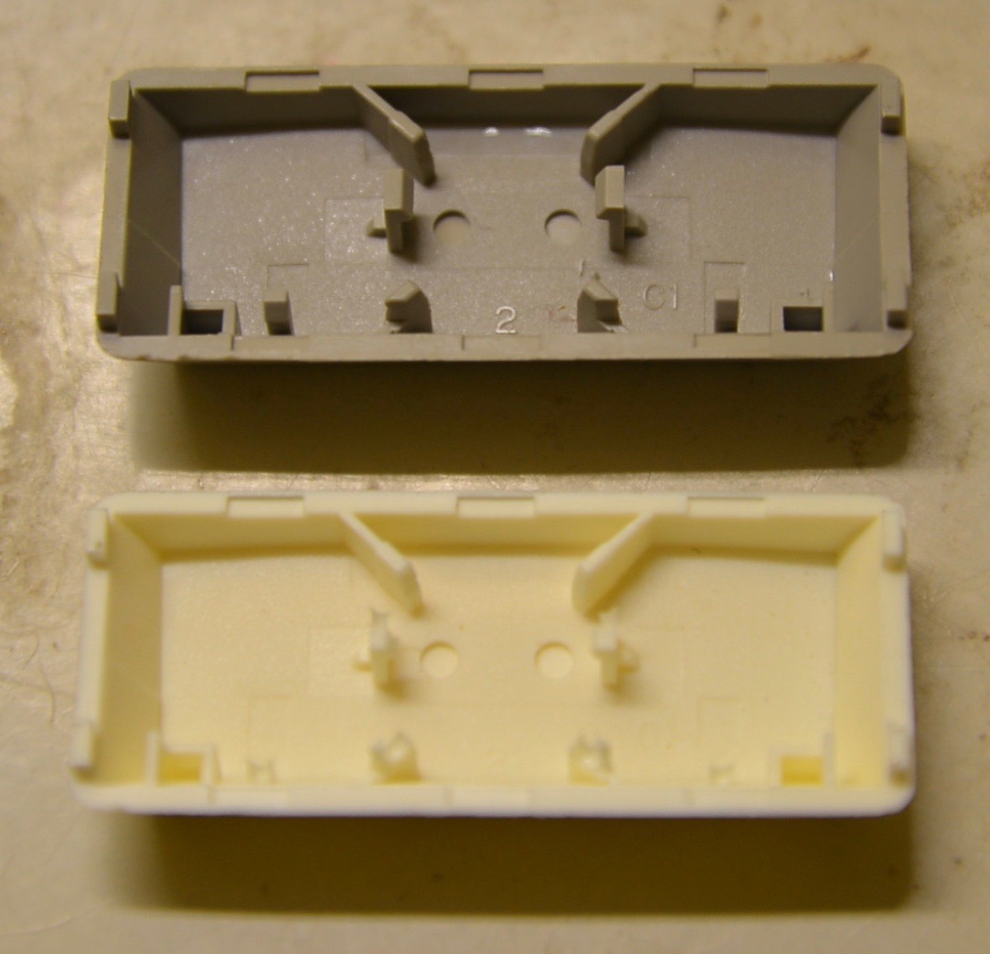 Bottom of key caps. Without the little tabs the stabilizer won't fit.