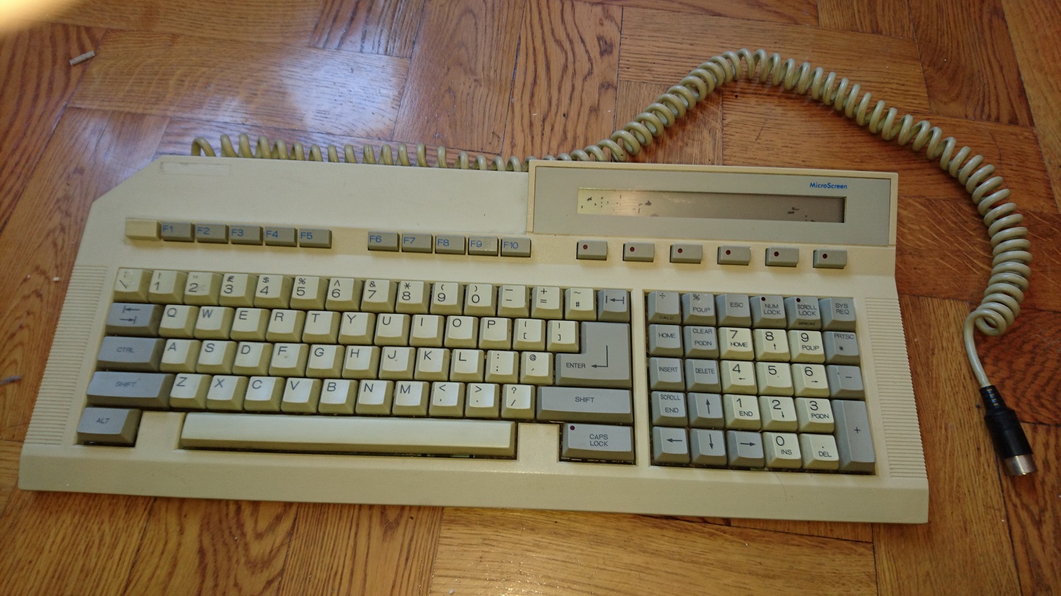 The keyboard itself in all its custom AT layout glory. The LCD seems to have seen some better days though unfortunately.