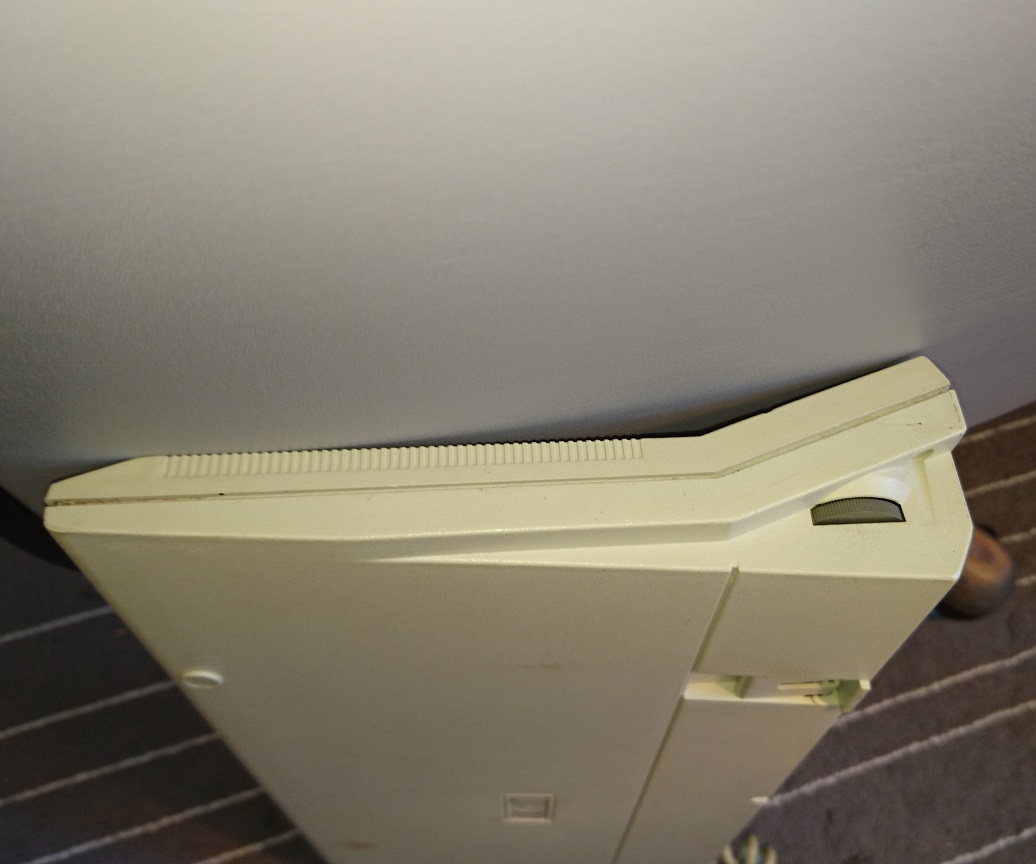 Side of the keyboard with contrast wheel for the LCD.