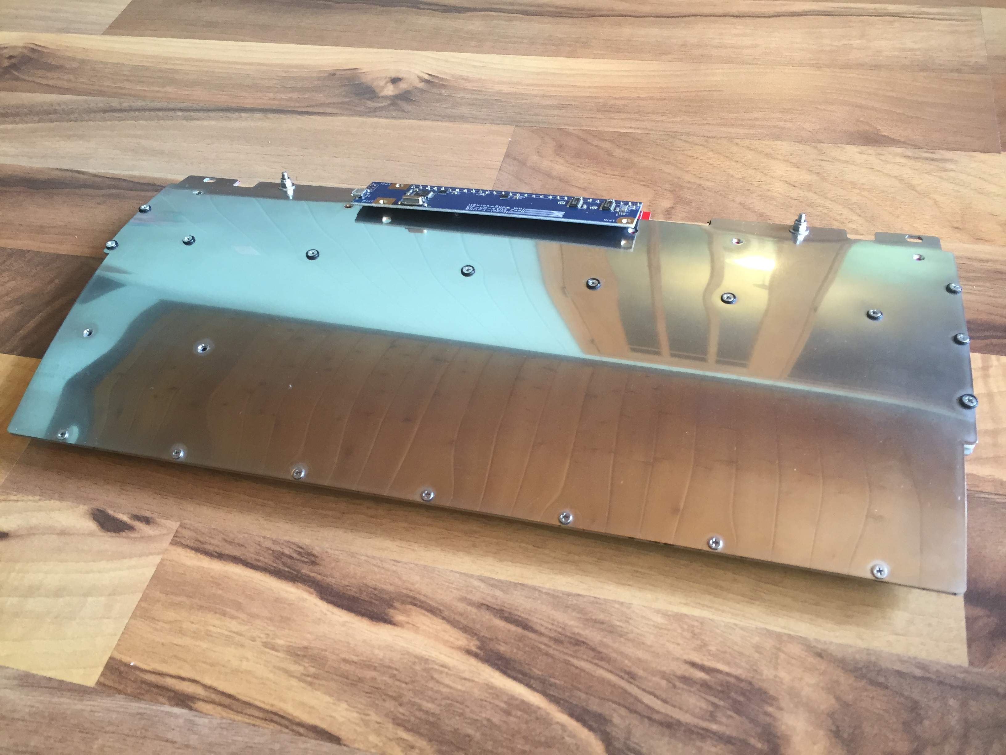 Assembly back...  I am not a fan of the medium polish, and will eventually "engine turn".  Any deformation you see around the screws is SLIGHT, but caused from my countersink being a little dull.  The good/bad thing about high luster finishes is they make MINOR deformations look HORRIBLE.  Trust me when I say that the finger can't perceive any change when rubbing across