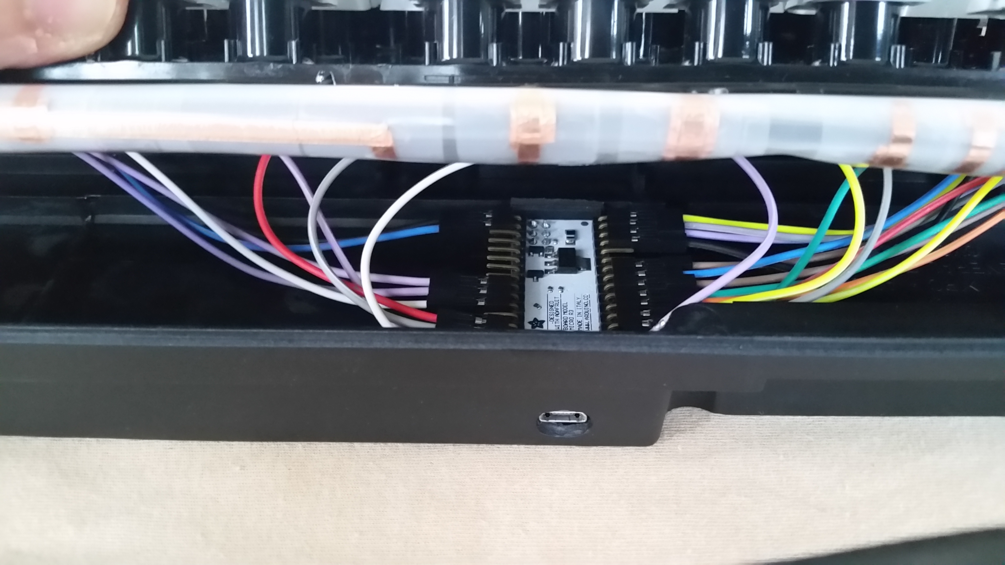 The controller fits snugly and can be taken out easily, just like on the Model M.