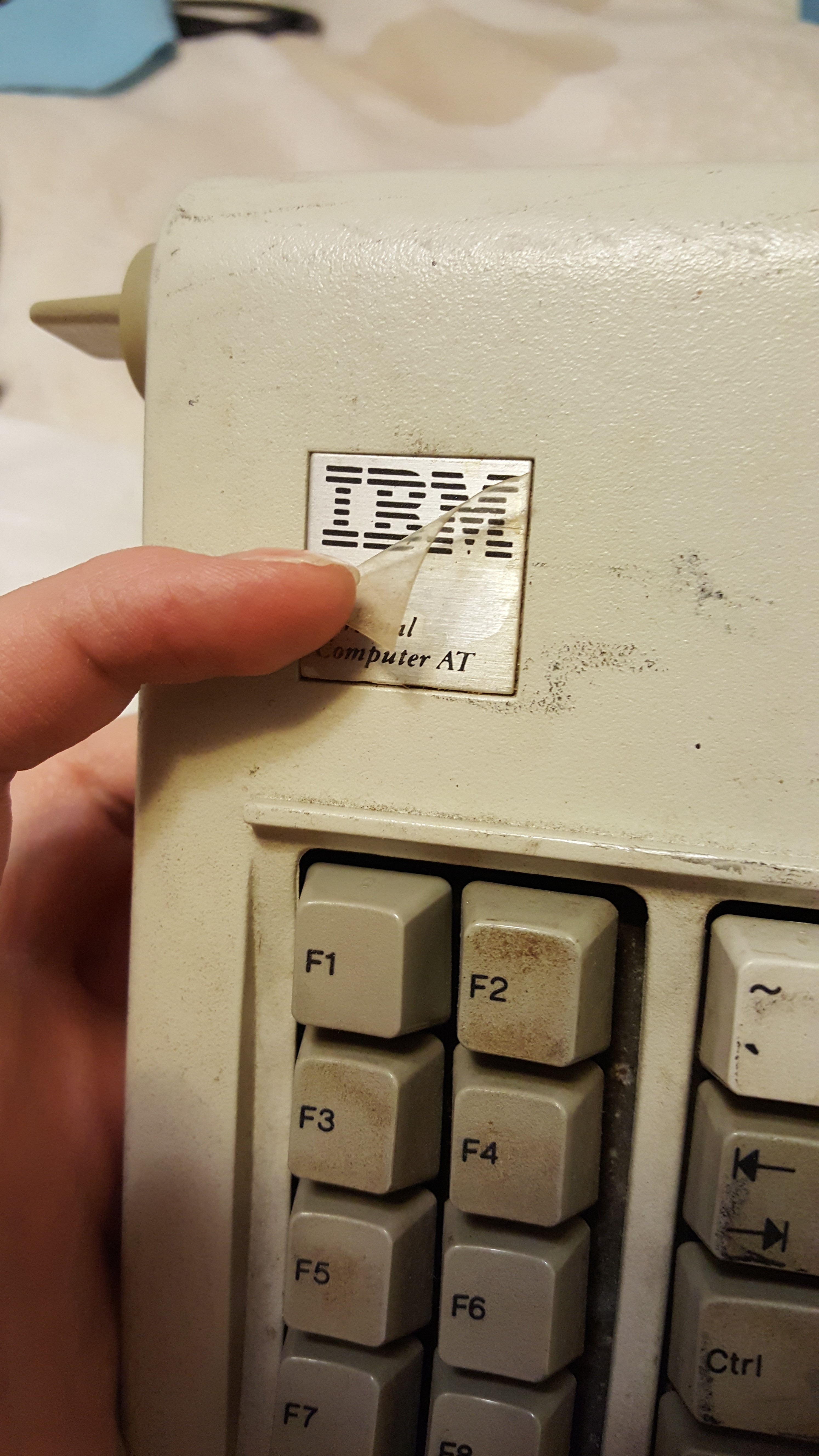 Nevermind, it's actually still got it's protective plastic. Way to go, person who never removed that!