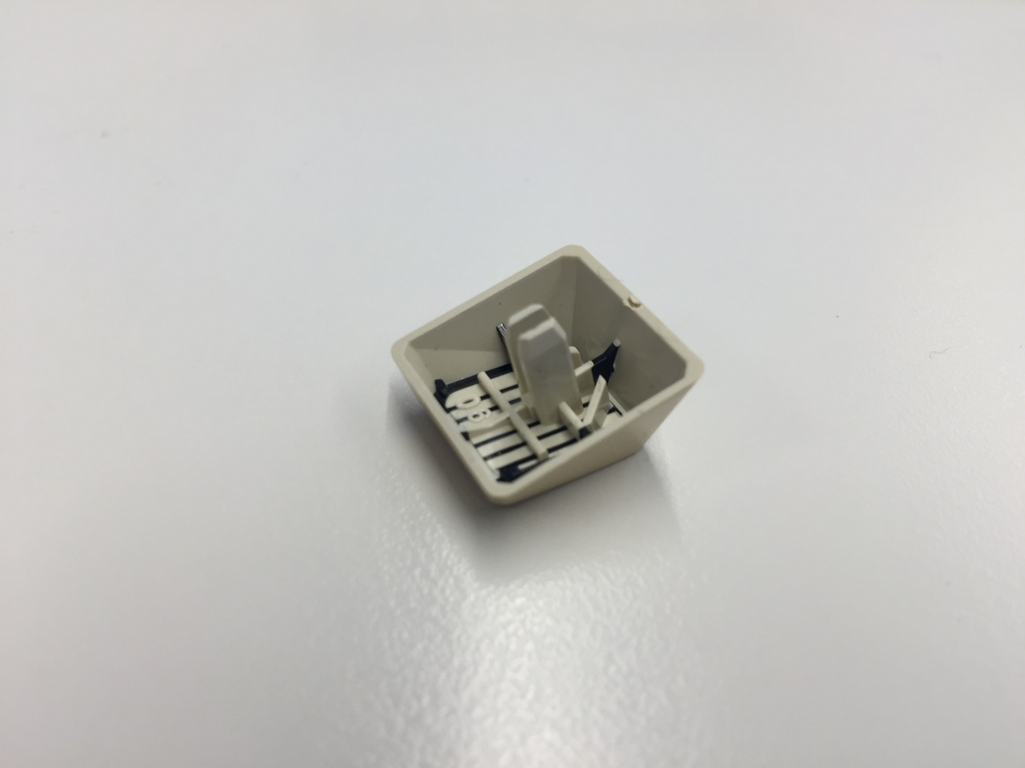 Keycap closeup. If this was to be converted to say MX I'm guessing that the stem inside has to be trimmed down.