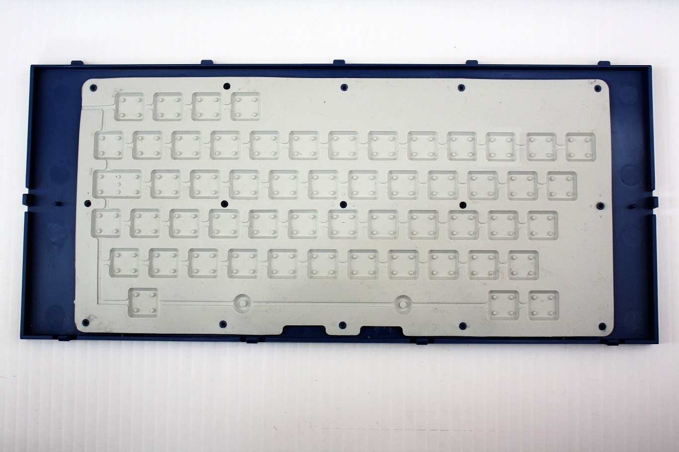 Rubber chicklet key membrane backside