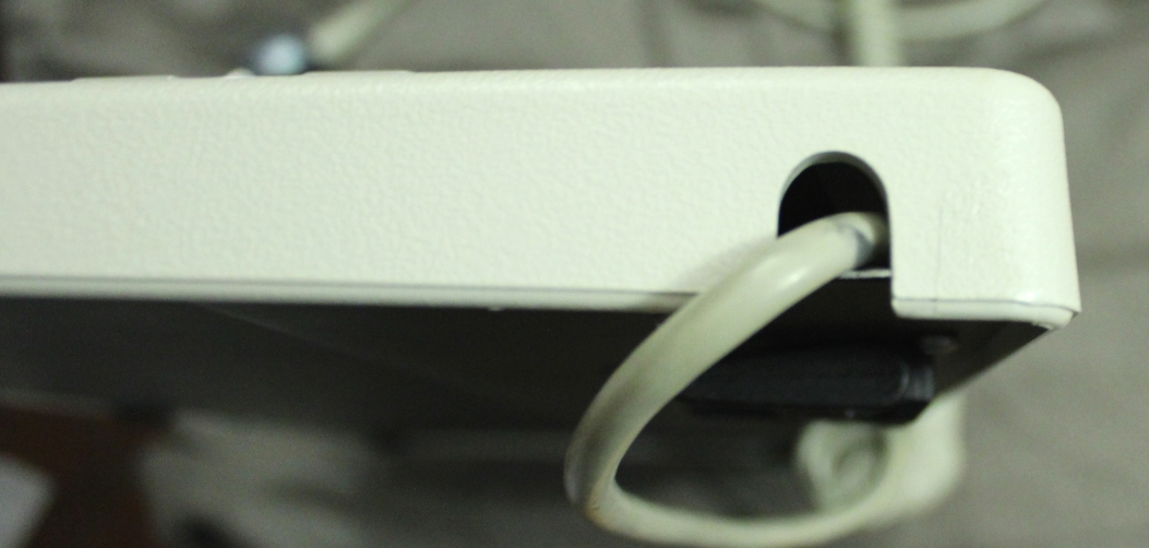 you can make the cable go out of the case on one side or on the other.