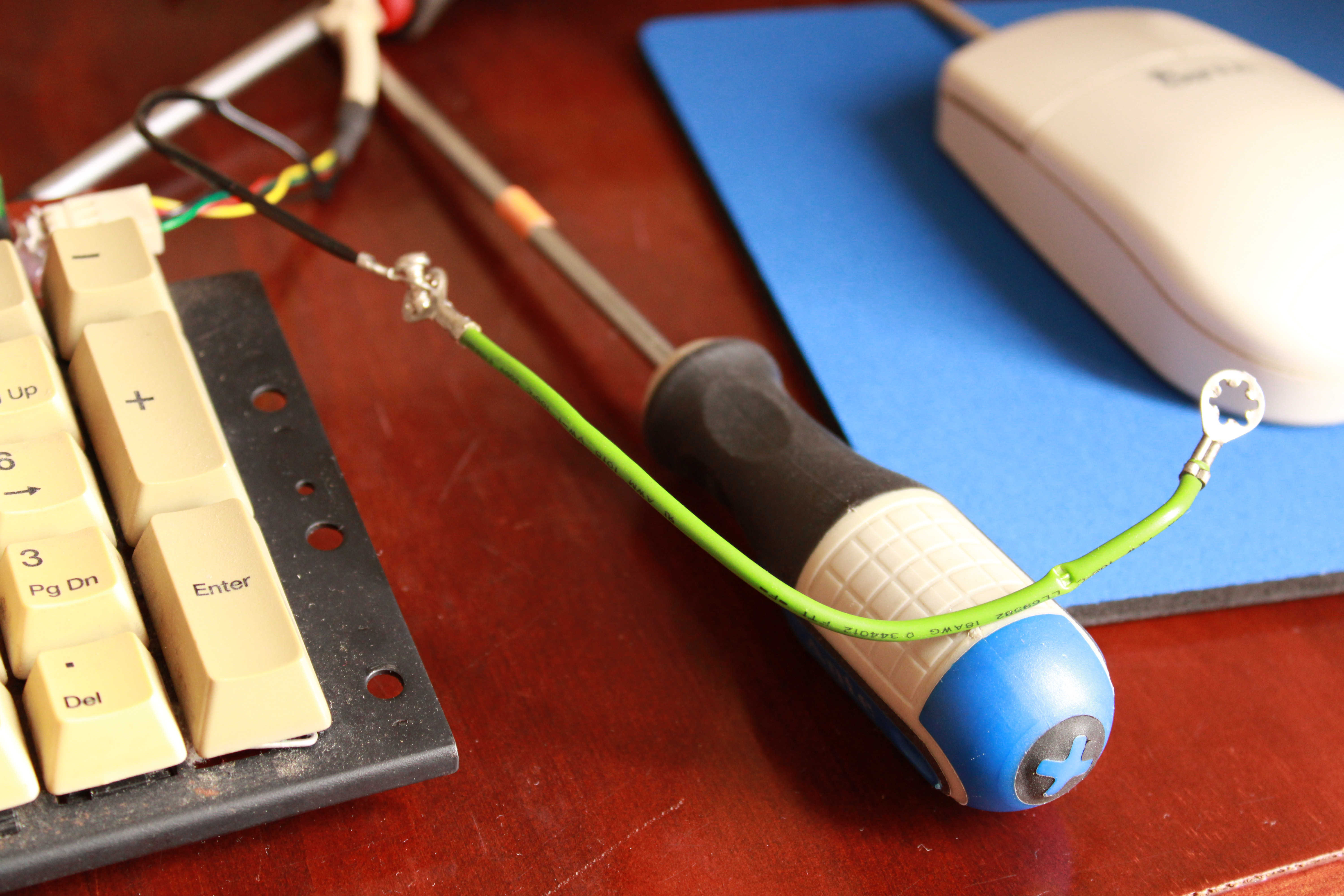 I don't understand what this green wire is used for. It was bitten and the end on the right wasn't really attached anywhere.