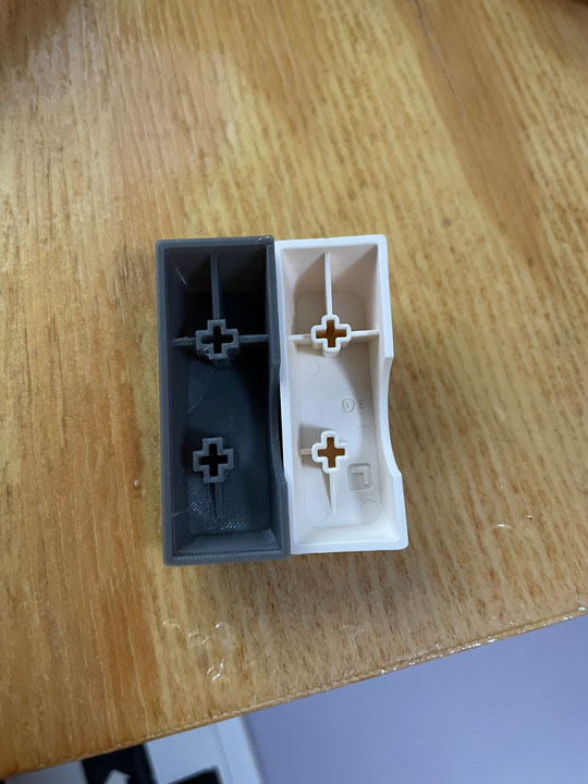 3D printed keycap left, original right. Bottom of button in this image goes towards top of mouse when fitted.
